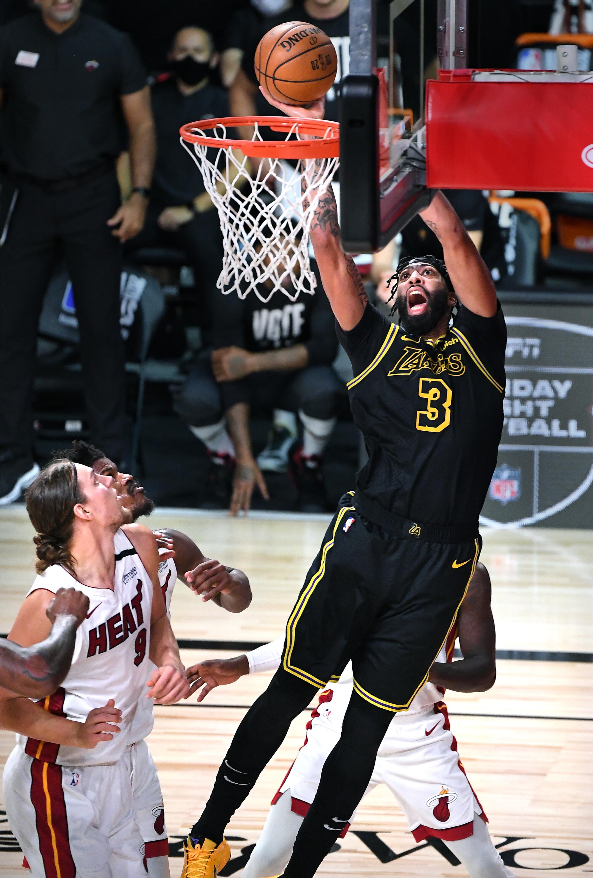 Lakers forward Anthony Davis scores a basket over the Miami defense in Game 2 of the NBA Finals.