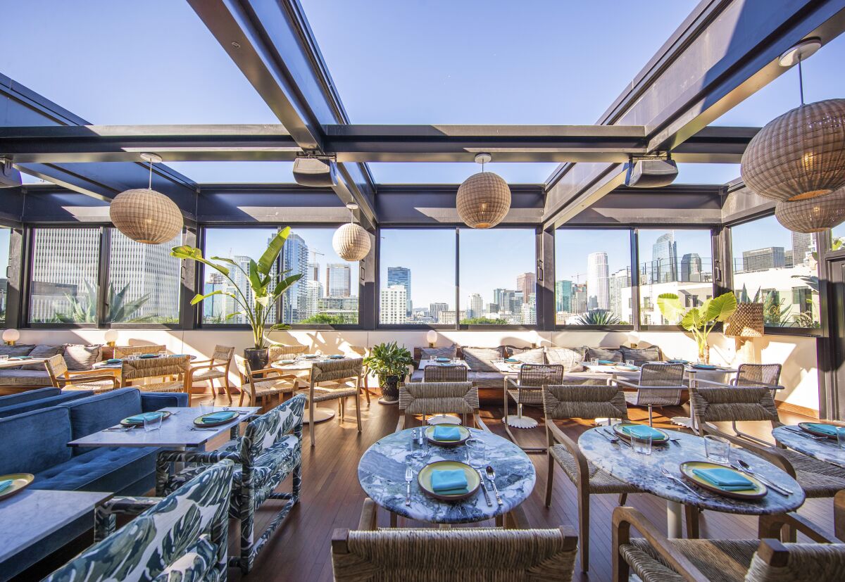 A rooftop restaurant with views of downtown Los Angeles.
