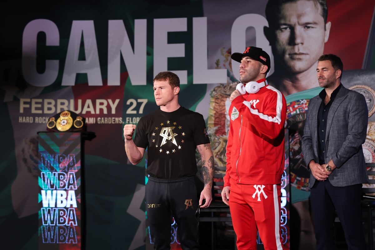Canelo Alvarez and Avni Yildirim pose for photographs at a news conference earlier this week promoting their fight.