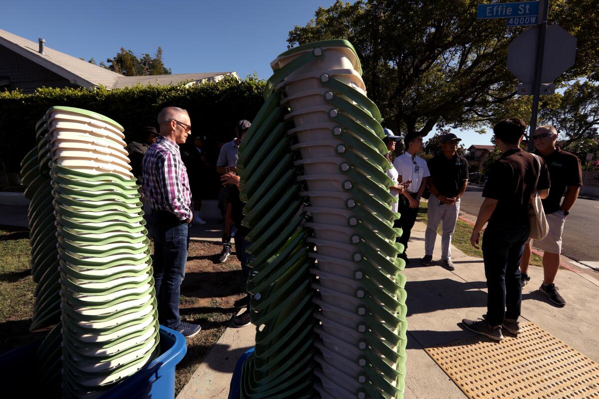 L.A. sanitation workers prepare to deliver in-home composting pails door to door in Los Feliz on Aug. 6. 