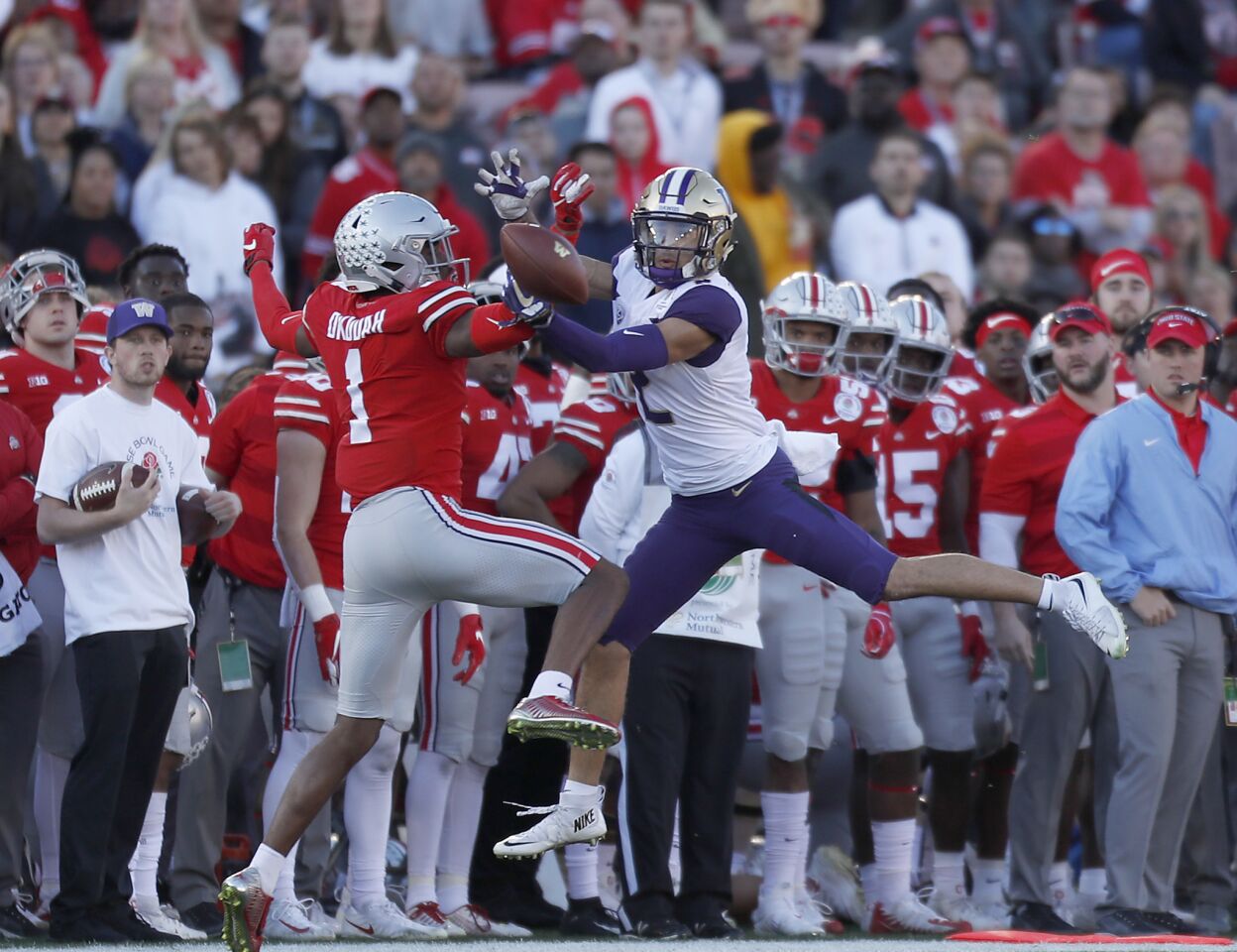 Ohio State cornerback Jeffrey Okudah breaks up a pass intended for Washington reciever Aaron Fuller in the second quarter on Jan. 1 at the Rose Bowl.