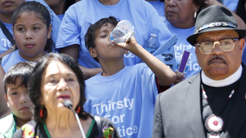 Civil rights activist Dolores Huerta, left, speaks in support of a clean water measure in Sacramento on Monday.