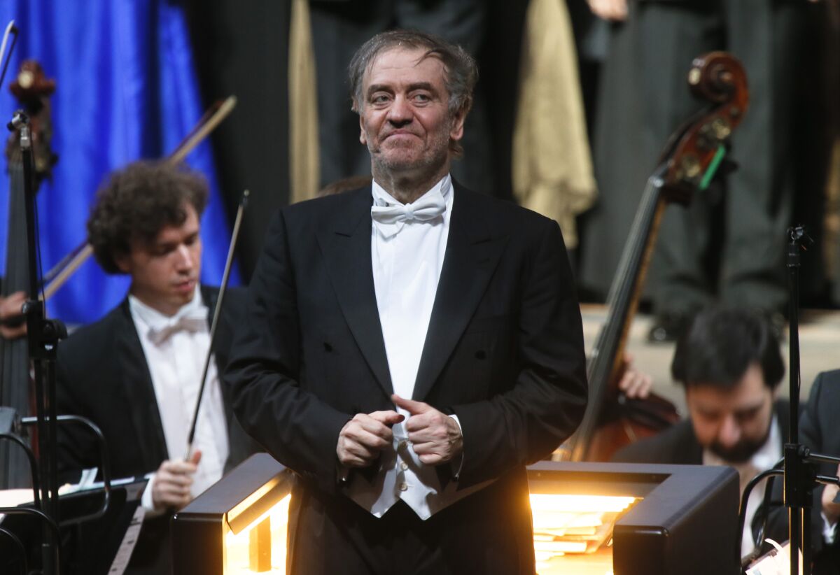 FILE - In this Wednesday, May 1, 2013 photo, Valery Gergiev, looks on after a "pre-premiere" performance, put on for veterans and senior employees of the theatre in the new Mariinsky Theatre on the eve of the it's official opening in St.Petersburg, Russia. Gergiev, a conductor who is close to Russia President Vladimir Putin, will not lead the Vienna Philharmonic in a five-concert U.S. tour that starts at Carnegie Hall on Friday night. The 68-year-old Russian conductor is music director of the Mariinsky Theatre in St. Petersburg, Russia, the White Nights Festival there and is chief conductor of the Munich Philharmonic. He received a Hero of Labor of the Russian Federation prize that Putin revived in 2013. Metropolitan Opera music director Yannick Nézet-Séguin will replace Gergiev for the Carnegie concerts. (AP Photo/Dmitry Lovetsky, File)