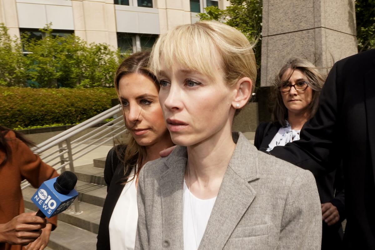 A woman leaves a courthouse