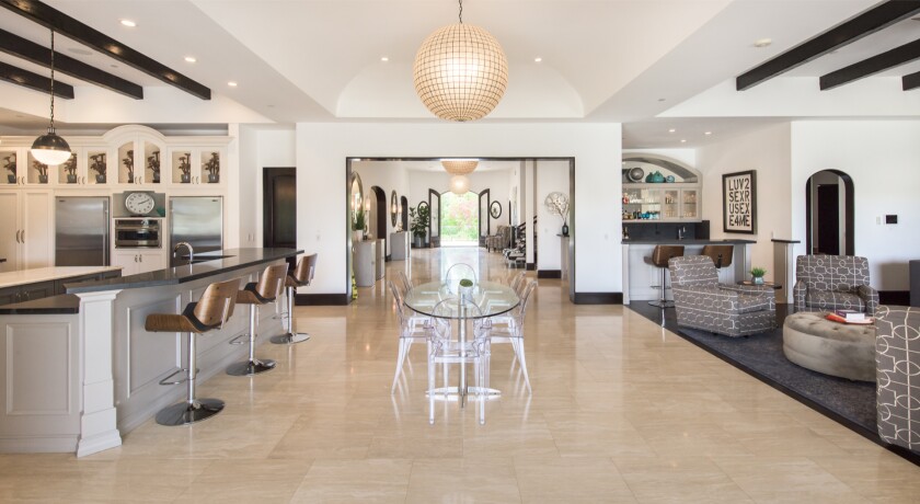 Kathy Griffin's massive Mediterranean estate includes eight bedrooms, 12 bathrooms and a 25,000-gallon infinity pool.