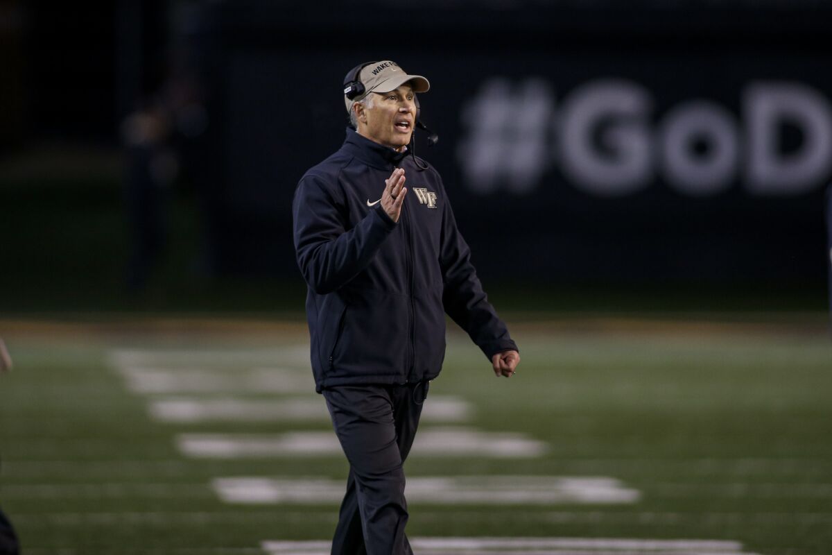 Wake Forest coach Dave Clawson talks on the sideline.