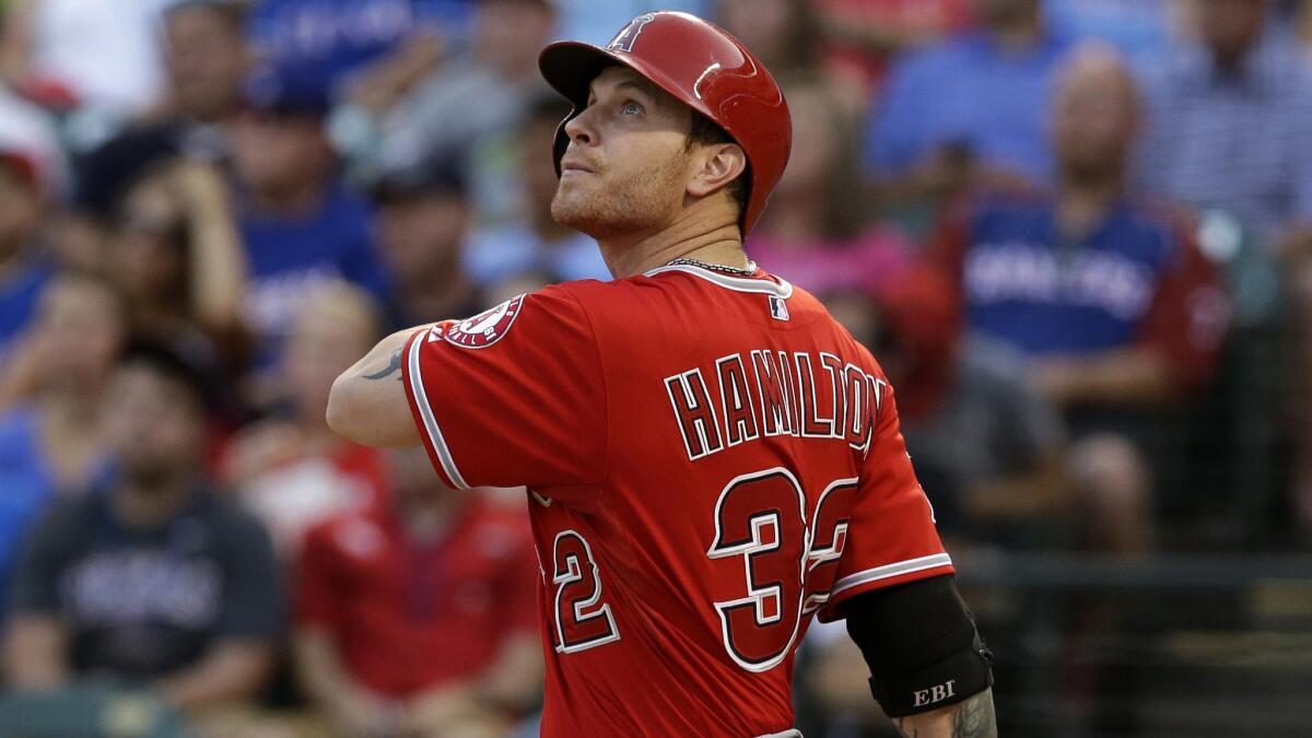 Angels left fielder Josh Hamilton flies out during a game against the Texas Rangers in July. Hamilton returned to the Angels' starting lineup Tuesday against the Boston Red Sox.