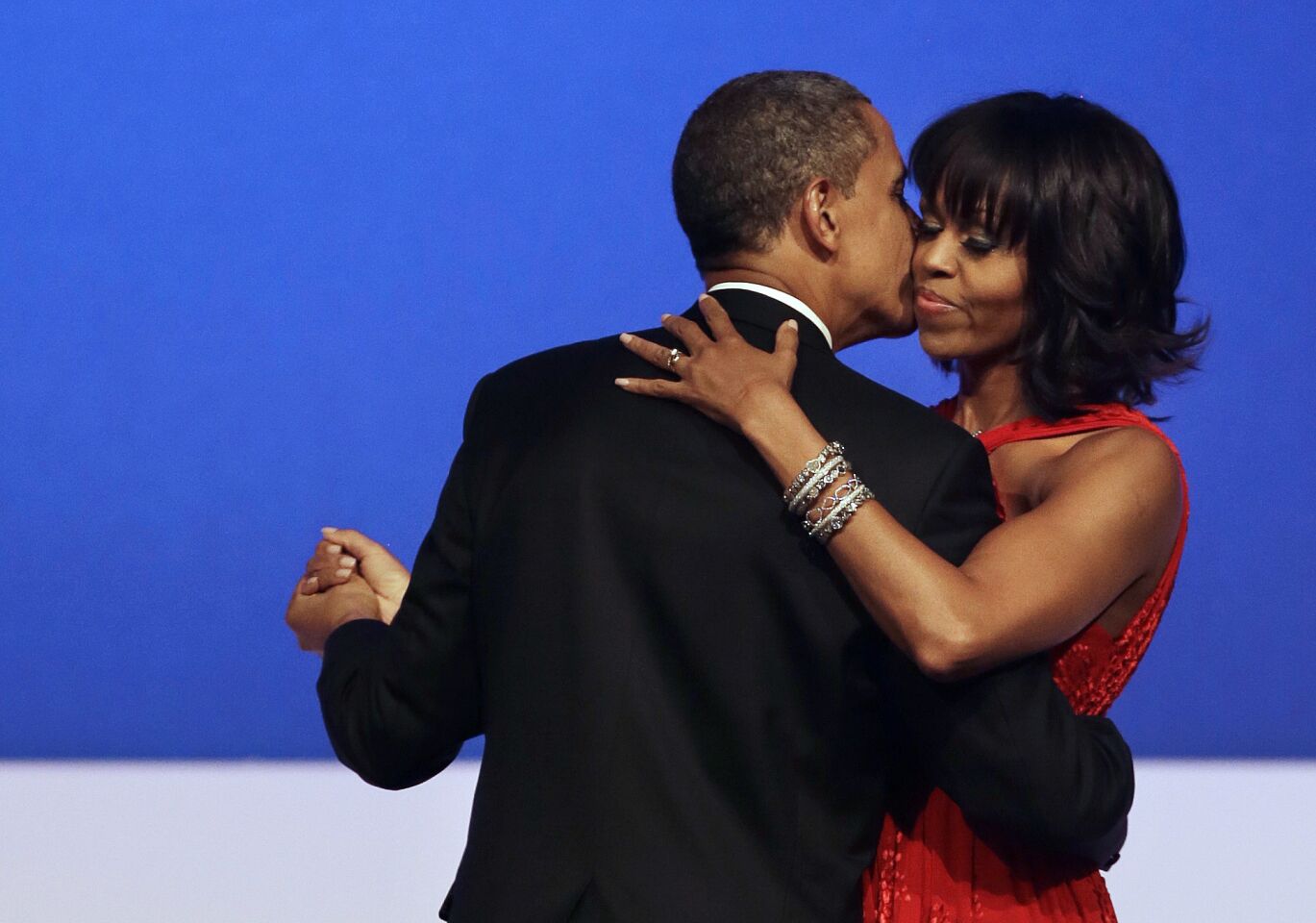 President Obama kisses First Lady Michelle Obama during their dance at the Commander-in-Chief Inaugural Ball at the Washington Convention Center.