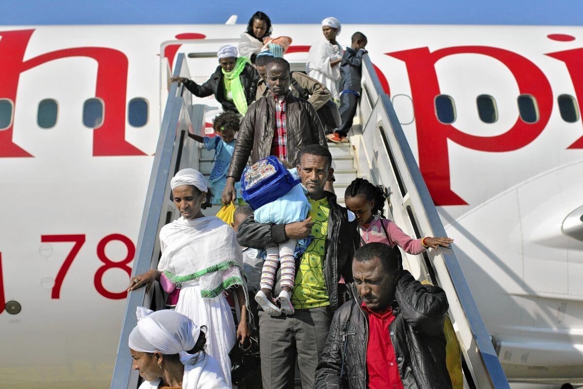 Jewish migrants from Ethiopia arrive in Israel in August 2013. Israel runs 16 immigrant absorption centers, which provide immigrants with housing and other aid.