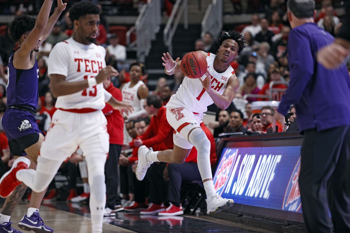 Texas Tech's Terrence Shannon Jr. (1) throws the ball before running out of bounds during the first half of an NCAA college basketball game against TCU, Saturday, Feb. 12, 2022, in Lubbock, Texas. (AP Photo/Brad Tollefson)