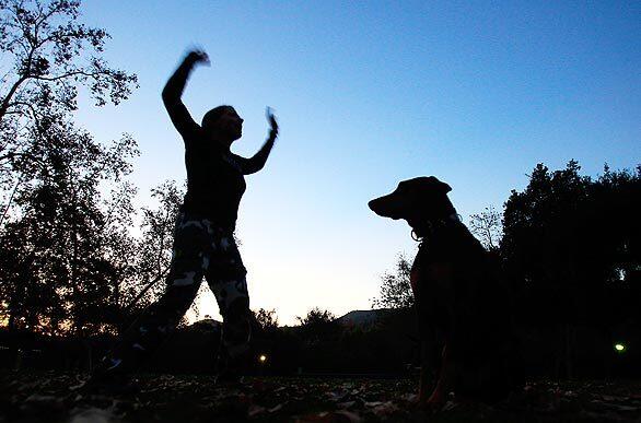 It's time for jumping jacks as Jill Bowers leads a boot camp for people and their dogs at Johnny Carson Park in Burbank. At Thank Dog Bootcamp, the dogs get not only exercise, but behavior training as well.