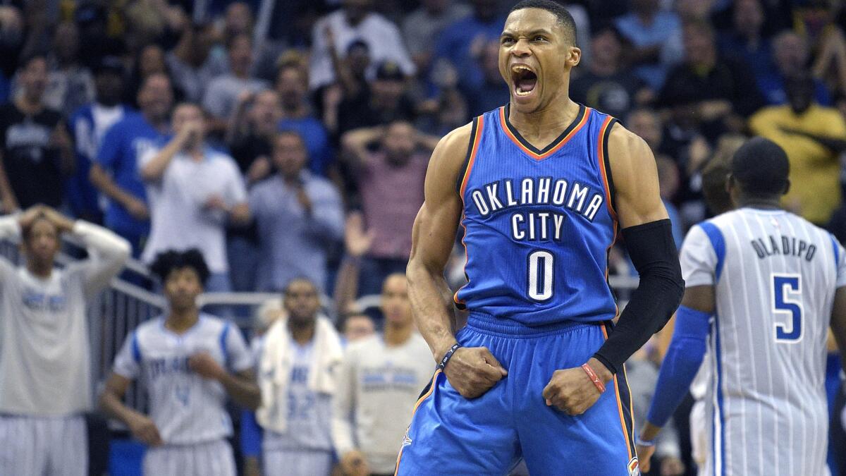 Thunder guard Russell Westbrook celebrates after tying the score with the Magic at the end of regulation on Friday night.