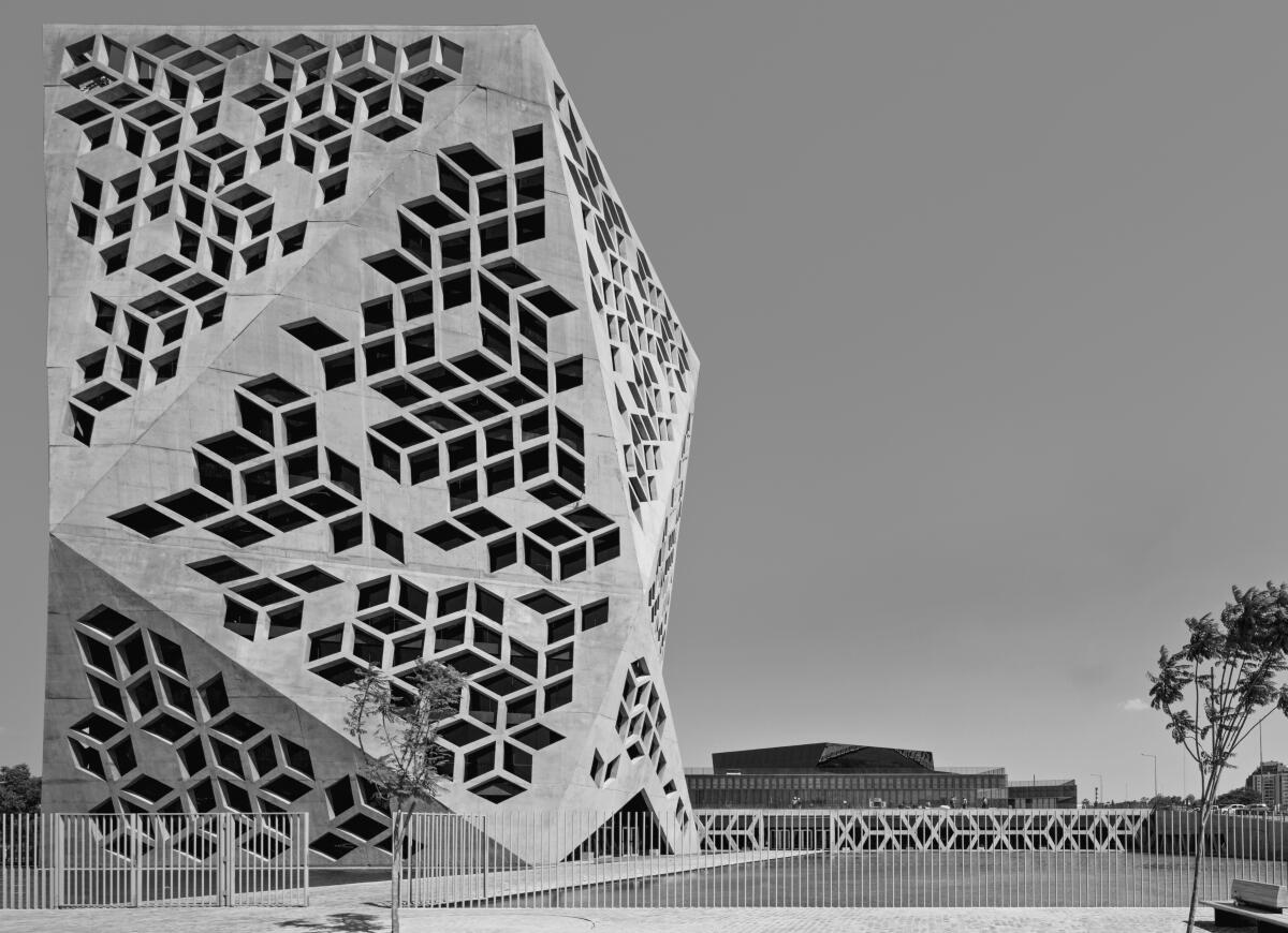 A polyhedral structure with tessellations of diamond-shaped openings.