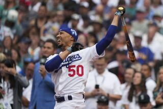 National League's Mookie Betts, of the Los Angeles Dodgers, hits during the first round.