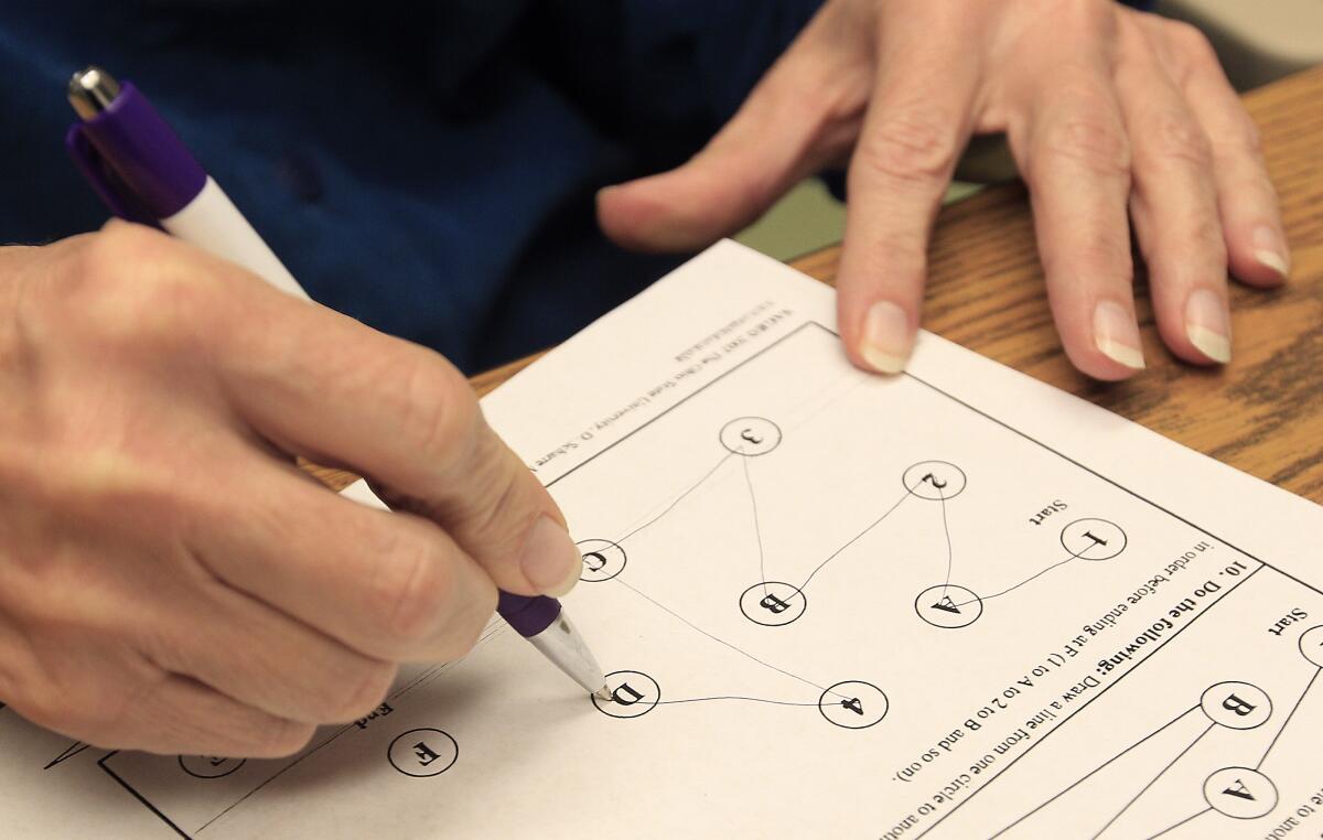 A patient takes a cognitive test. 