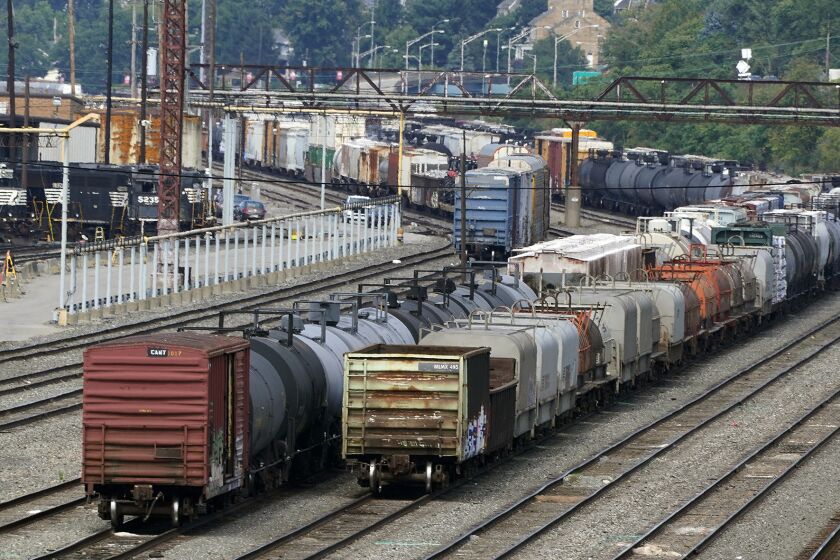 Freight cars wait to be hauled out of the Norfolk Southern Conway Terminal in Conway, Pa., Thursday, Sept. 15, 2022. (AP Photo/Gene J. Puskar)