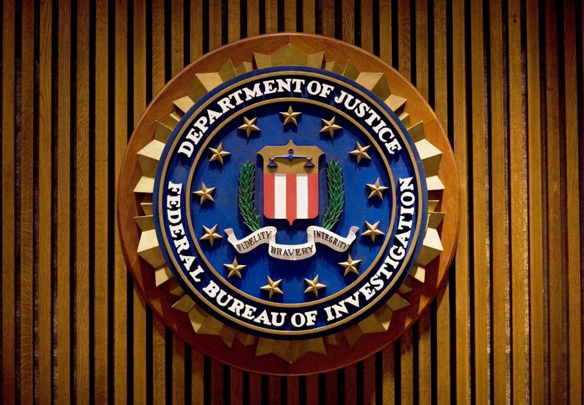 The crest of the FBI inside the J. Edgar Hoover Building in Washington, D.C. A recently fired FBI agent has been indicted on charges accusing him of stealing more than $100,000 in drug money.