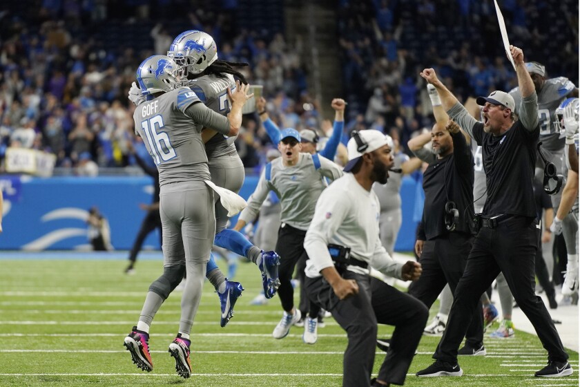 The Detroit Lions celebrate their last second come from behind win over th eMinnesota Vikings in an NFL football game, Sunday, Dec. 5, 2021, in Detroit. (AP Photo/Paul Sancya)