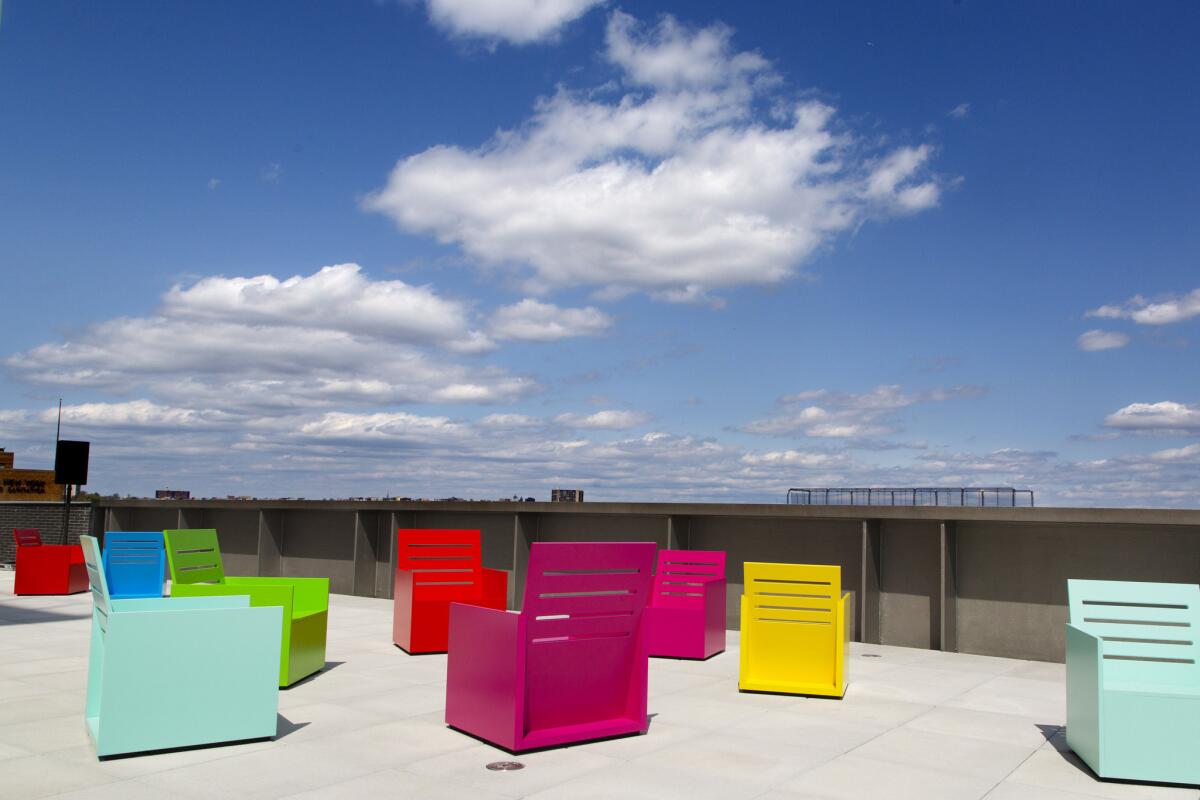 Mary Heilmann's painted chairs on a terrace at New York's Whitney Museum of American Art.