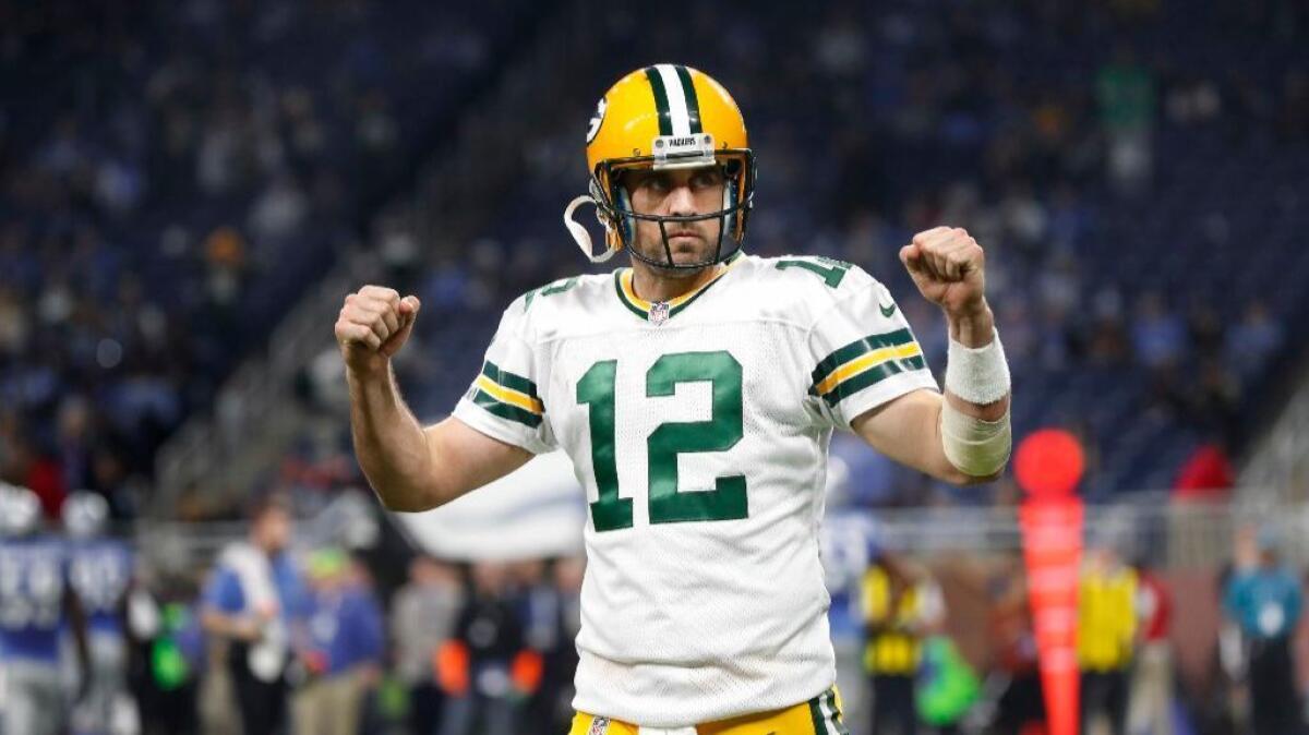 Packers quarterback Aaron Rodgers celebrates during a game against the Lions on Jan. 1.