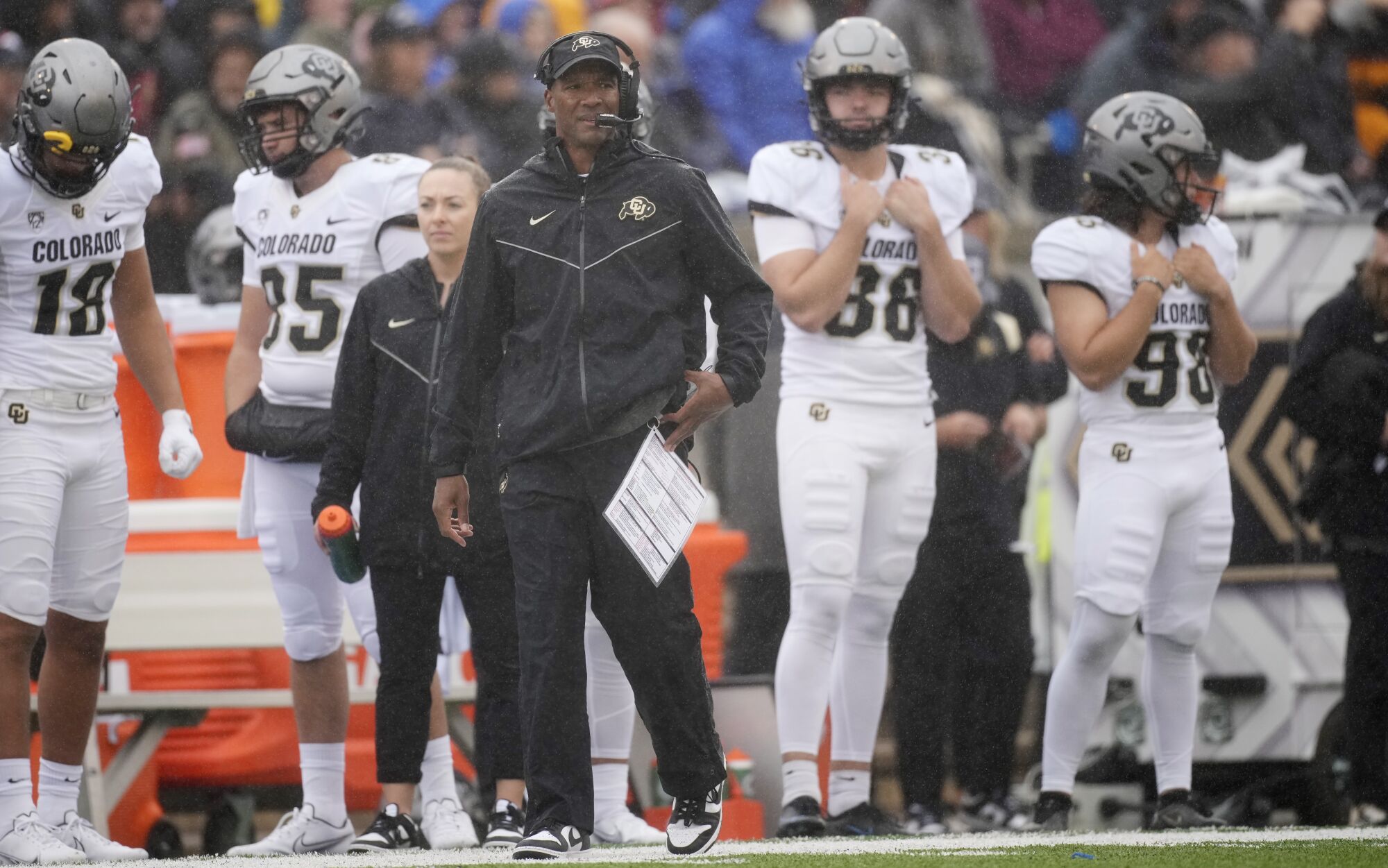 Colorado coach Karl Dorrell watches from the sideline as his team plays Air Force on Sept. 10