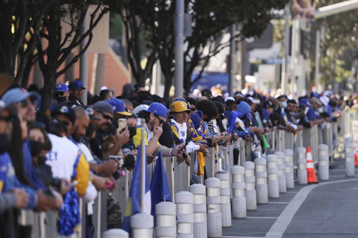 Fans line the street waiting for the victory parade.