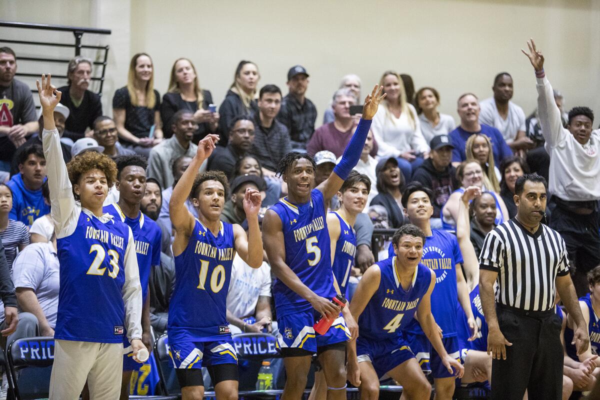 Fountain Valley's bench cheers for a teammate in the final minutes of the CIF State Southern California Regional Division III quarterfinal playoff game at Price on Thursday.