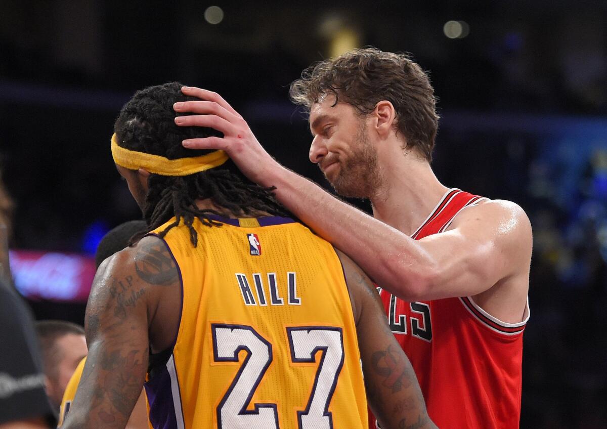Bulls forward Pau Gasol congratulates Lakers center Jordan Hill after L.A. beat Chicago, 123-118, in double overtime at Staples Center on Thursday night.