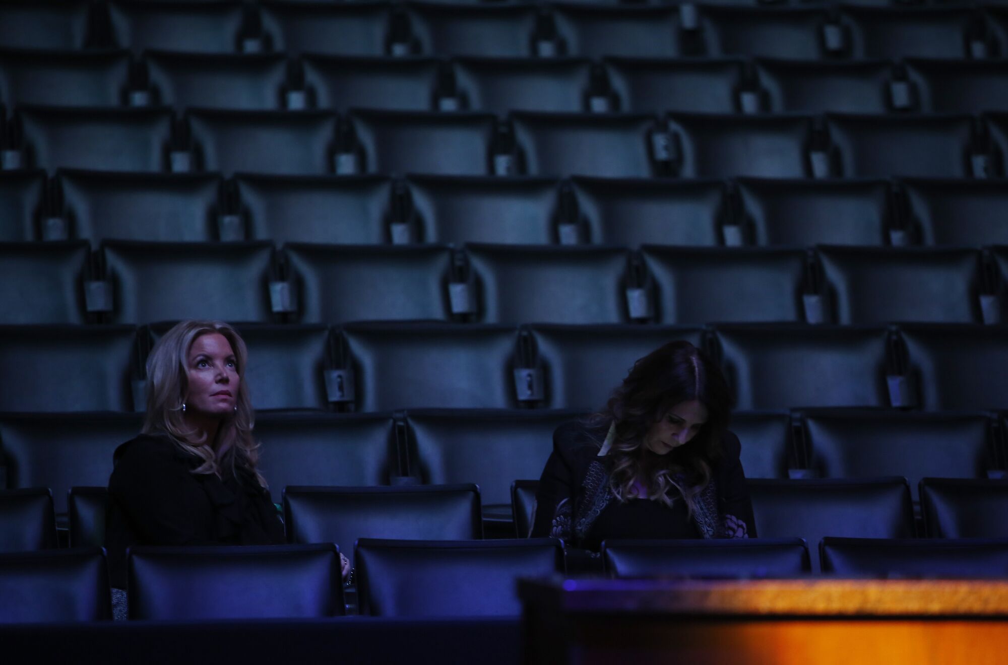 Jeanie Buss sits in the stands at Staples Center during a Lakers all-access event for fans.