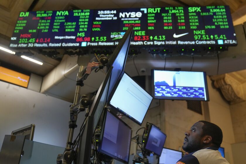 Traders work on the floor at the New York Stock Exchange in New York, Thursday, Nov. 10, 2022. (AP Photo/Seth Wenig)