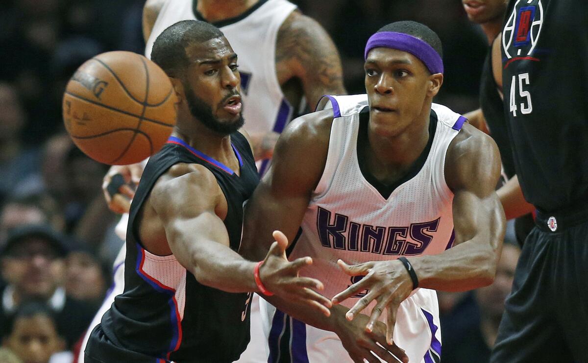 Clippers guard Chris Paul forces Kings guard Rajon Rondo to pass during the first half of a game at Staples Center on Jan. 16.