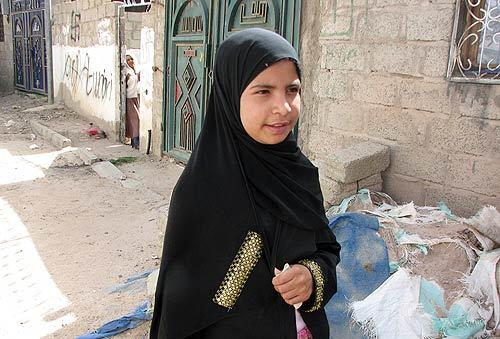 Nujood Ali, 10, stands near her home on the outskirts of Sana, Yemen. Her father gave Nujood's hand in marriage to a man three times her age.