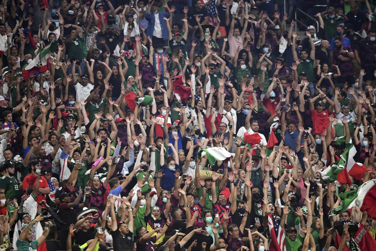 Soccer fans cheer during the first half of the CONCACAF Gold Cup final between the U.S. and Mexico 