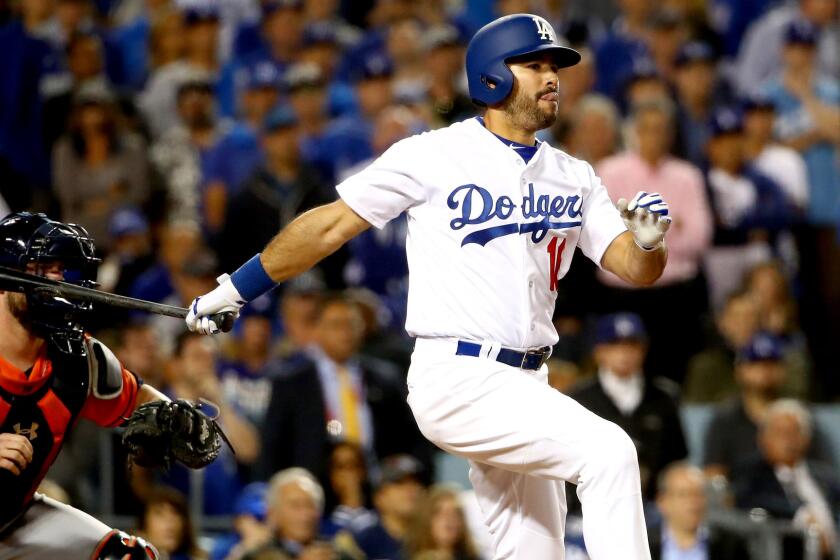 Pinch-hitter Andre Ethier follows through on a run-scoring single against the Astros during the sixth inning of Game 7.