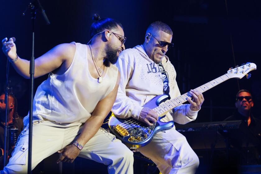 Los Angeles, CA - May 04: Henry Santos (left) and Max Santos (right) of Adventura perform at Crypto Arena on Saturday, May 4, 2024 in Los Angeles, CA. (Carlin Stiehl / For De Los)