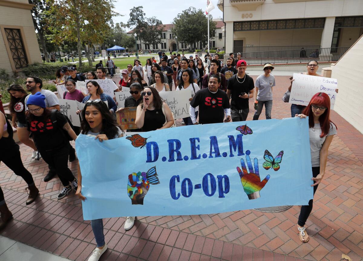 Students march through the Fullerton College campus chanting, "Undocumented and unafraid."