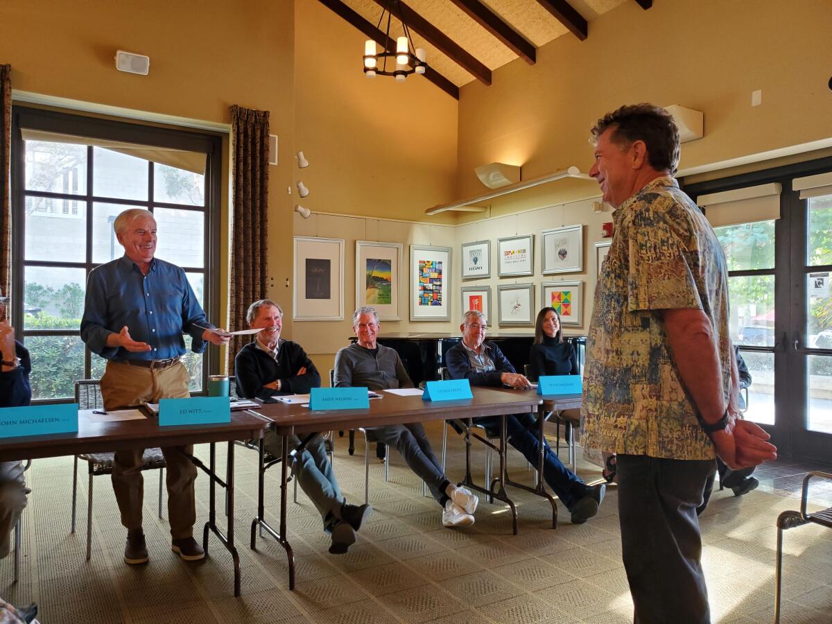Enhance La Jolla President Ed Witt (in blue shirt) commends community volunteer Chris Cott.
