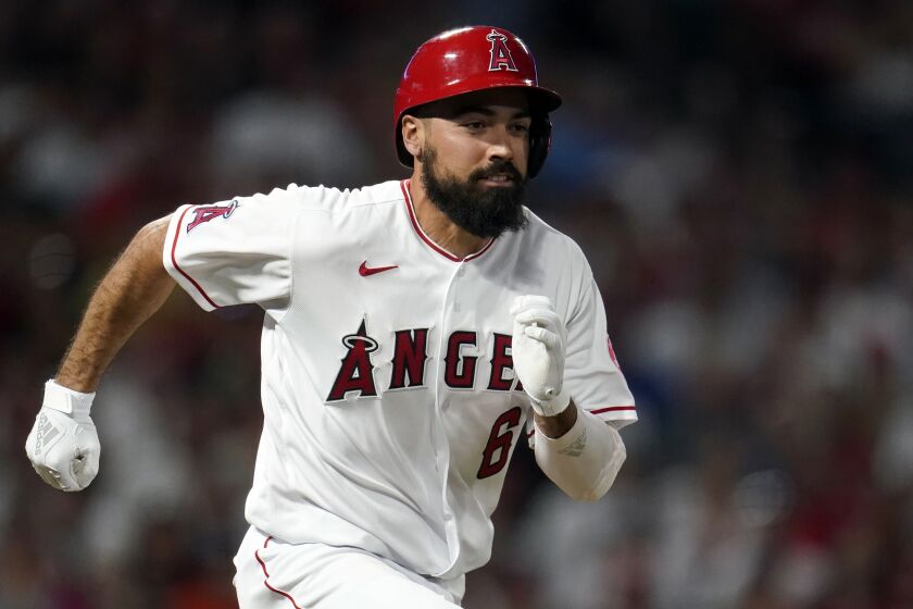 Los Angeles Angels' Anthony Rendon runs to first base during a baseball game against the Houston Astros Friday, April 8, 2022, in Anaheim, Calif. (AP Photo/Marcio Jose Sanchez)