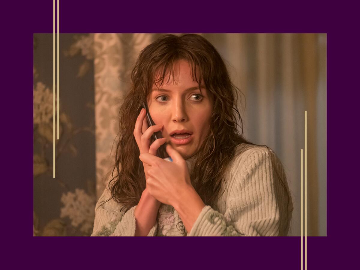  Annabelle Wallis talks on the phone with a scared expression in a scene from "Malignant."