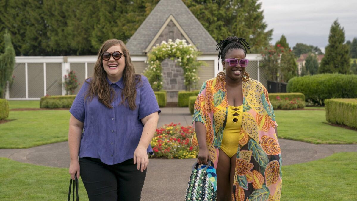 Annie (Aidy Bryant) and Fran (Lolly Adefope) attend the Fat Babe Pool Party in "Shrill."