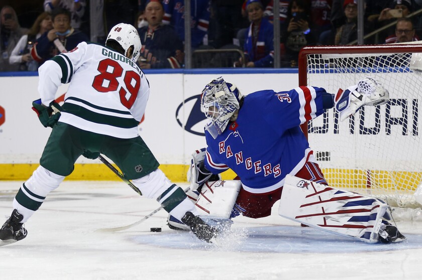 New York Rangers' goalie Igor Shesterkin (31) saves a penalty shot attempt by Minnesota Wild's Frederick Gaudreau (89) during the second period of an NHL hockey game Friday, Jan. 28, 2022, in New York. (AP Photo/John Munson)