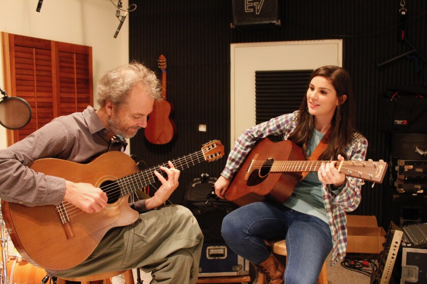 Peter Sprague and Nina Francis are shown in one room of Sprague's Leucadia recording studio, SpragueLand.