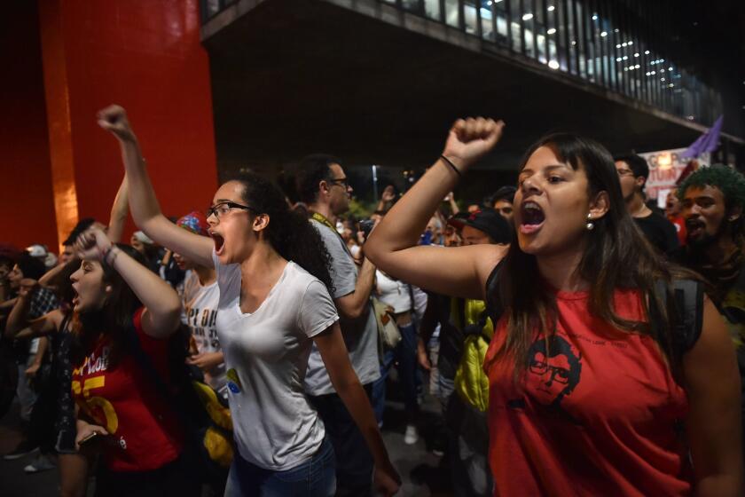 Supporters of suspended Brazilian President Dilma Rousseff protest in Sao Paulo. Brazilian senators engaged in marathon debate Tuesday on the eve of voting on whether to strip Rousseff of the presidency.