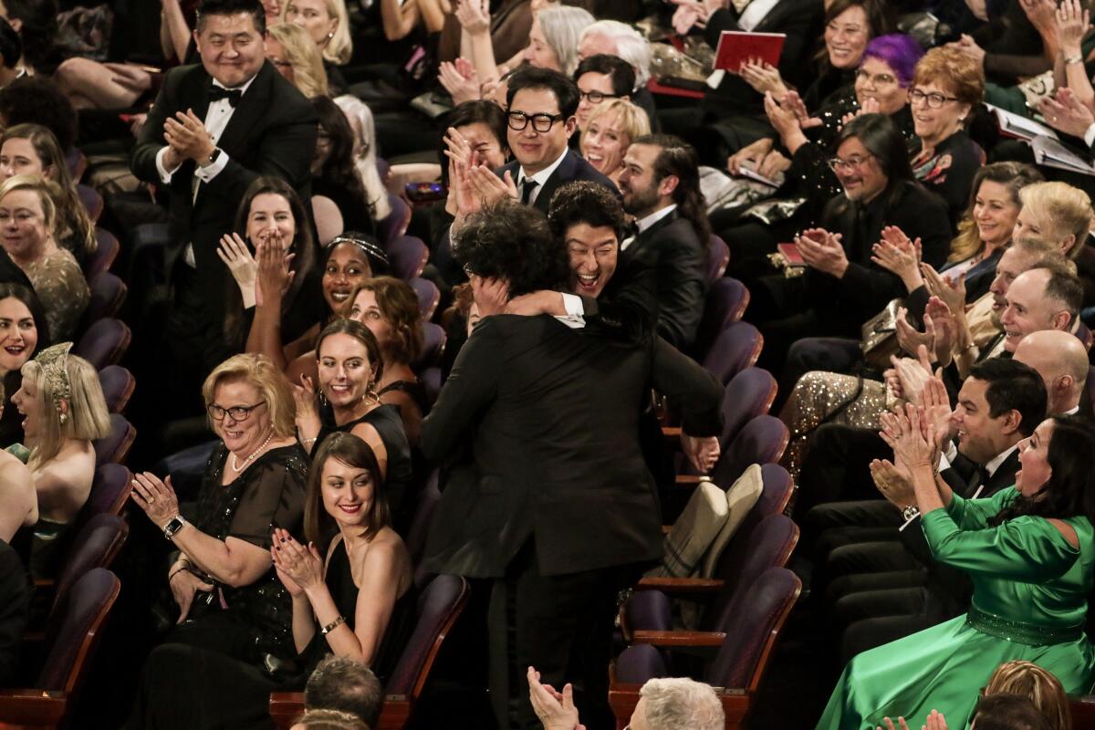 Song Kang Ho congratulates Bong Joon Ho, winner of the international feature Oscar for “Parasite,” during the telecast of the 92nd Academy Awards.