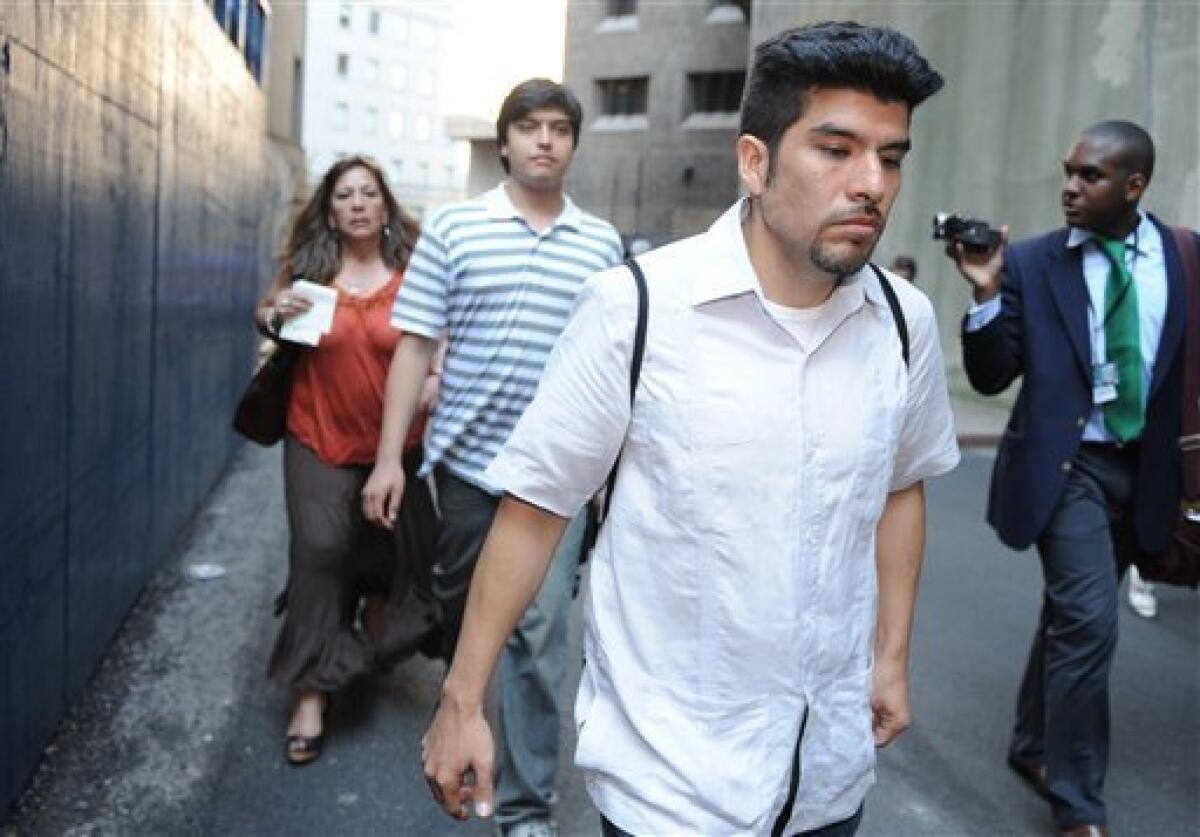 Sons of accused spy Vicky Pelaez, Waldo Mariscal, foreground, Juan Jose Lazaro and sister of Pelaez, Raquel Pelaez Ocampo, left, leave Manhattan federal court, Thursday, July 8, 2010, in New York. (AP Photo/Louis Lanzano)