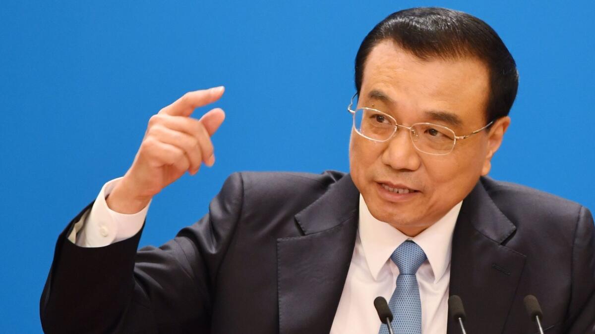 China's Premier Li Keqiang called on the United States to not act "emotionally" and to avoid a trade war.