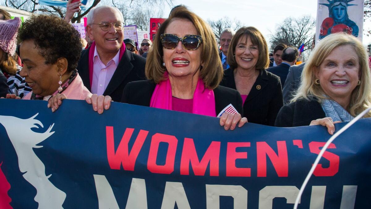 Among those marching Saturday in Washington was House Minority Leader Nancy Pelosi (D-San Francisco), center.