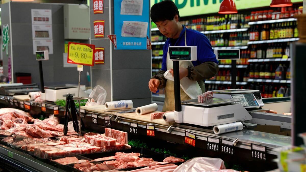 A pork counter in a supermarket in Beijing. China is set to levy tariffs on $3 billion worth of U.S. goods after President Trump announced plans to impose tariffs on some Chinese imports.