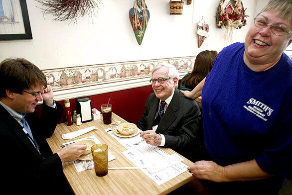 Debbie Marker, a waitress at Smith's Family Restaurant in Georgetown, Del., greets Dominick Dunne during a lunch break amid the trial of former Walt Disney Co. President Michael Ovitz. The trial in Delaware Chancery Court stemmed from a shareholder lawsuit seeking to recover Ovitz's severance.