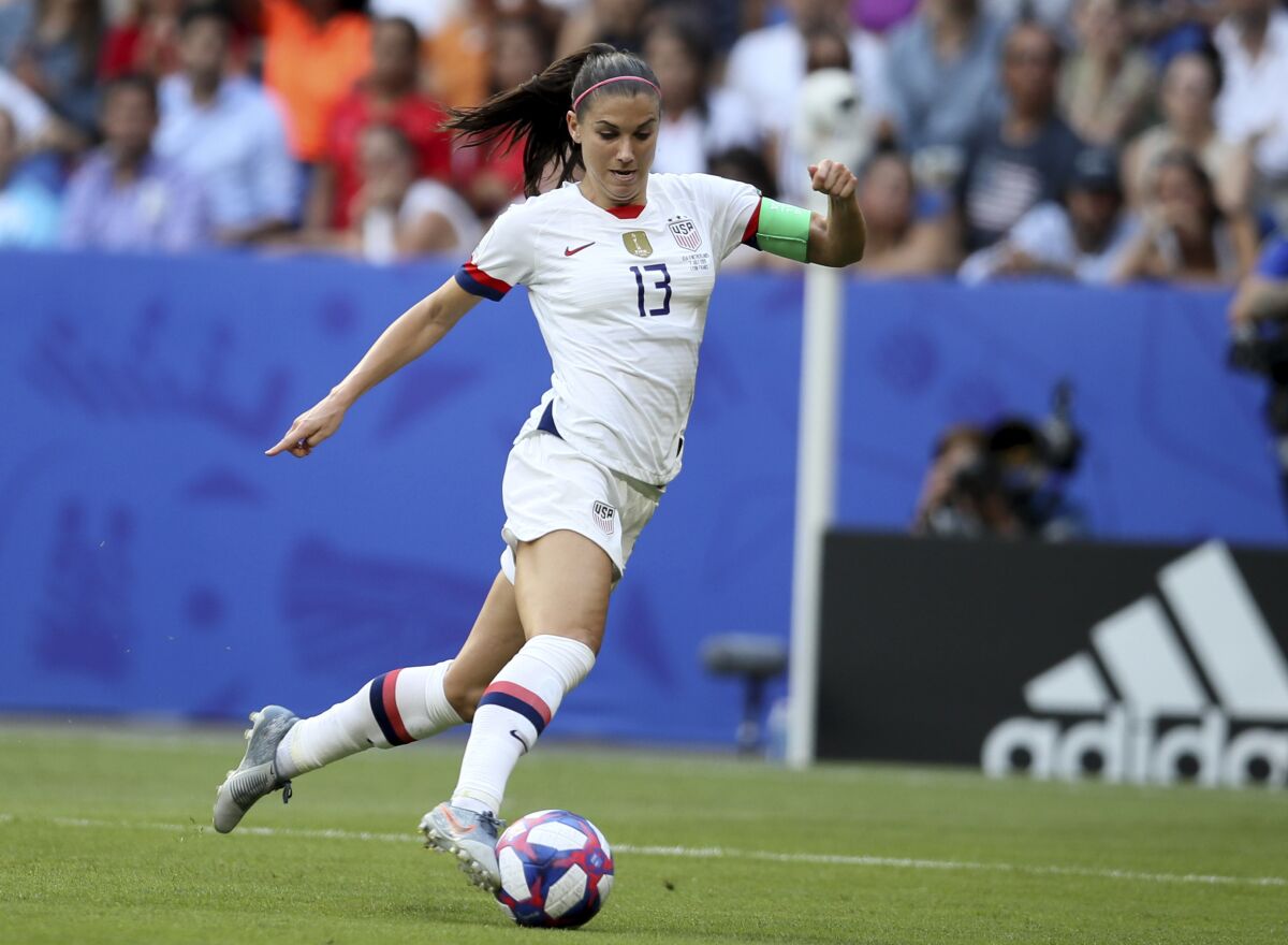 FILE - In this July 7, 2019, file photo, United States' Alex Morgan controls the ball during the Women's World Cup final soccer match against The Netherlands at the Stade de Lyon in Decines, outside Lyon, France. Tottenham secured the biggest signing yet in a summer of high-profile acquisitions in the Women’s Super League by bringing in United States striker Alex Morgan on a one-season deal. The 31-year-old Morgan will play in England for the first time and moves four months after giving birth to her first child. (AP Photo/David Vincent, File)